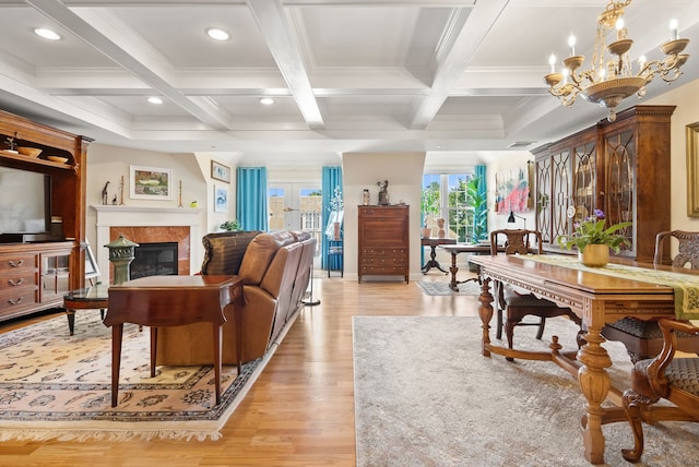 living room featuring beam ceiling, coffered ceiling, and light wood-type flooring