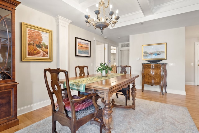 dining area with beamed ceiling, a chandelier, light hardwood / wood-style flooring, and ornate columns