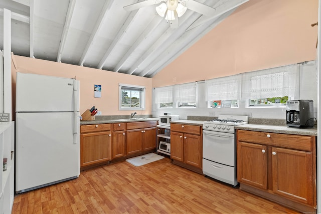 kitchen featuring ceiling fan, beamed ceiling, white appliances, high vaulted ceiling, and light hardwood / wood-style floors