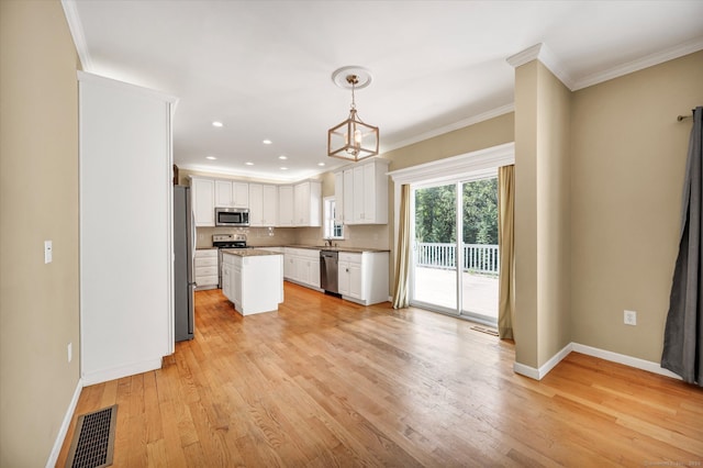 kitchen featuring light hardwood / wood-style floors, sink, stainless steel appliances, and white cabinets