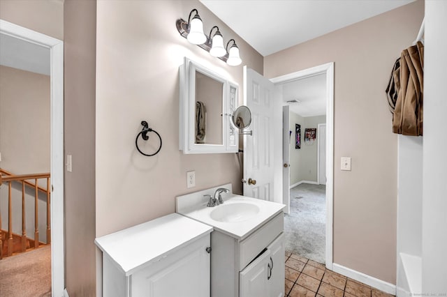 bathroom with tile patterned floors and vanity