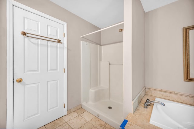 bathroom featuring separate shower and tub and tile patterned flooring