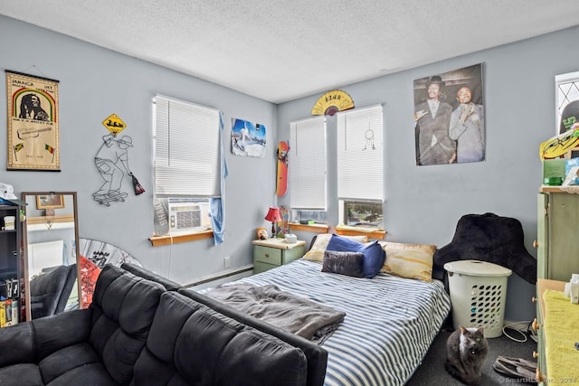 carpeted bedroom featuring cooling unit, multiple windows, baseboard heating, and a textured ceiling