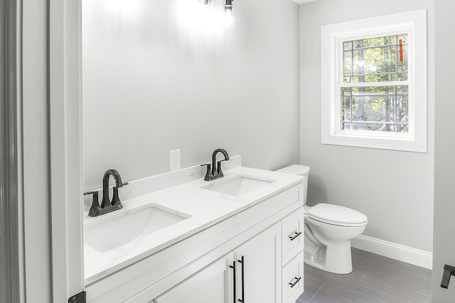 bathroom with vanity and toilet