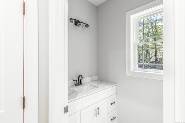 bathroom with vanity and plenty of natural light