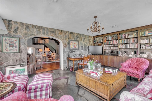 living room with an inviting chandelier