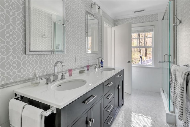 bathroom featuring walk in shower, crown molding, and vanity