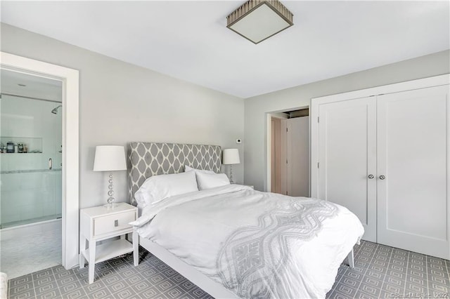 bedroom featuring a closet and ensuite bathroom