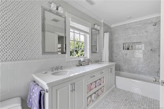 full bathroom with shower / bath combination with curtain, vanity, tile walls, crown molding, and toilet