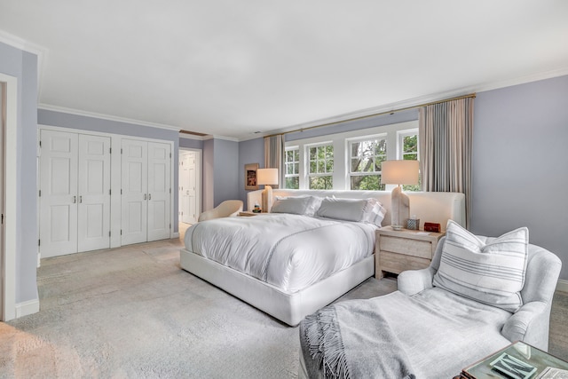 bedroom with light colored carpet and crown molding