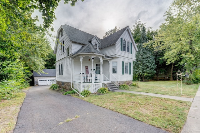 victorian house with covered porch and a front yard