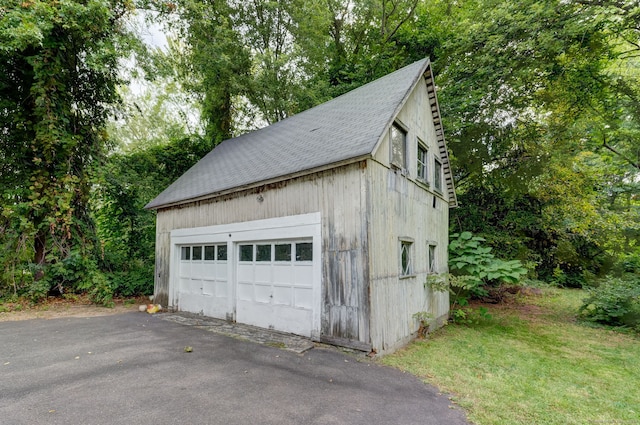 garage featuring wood walls