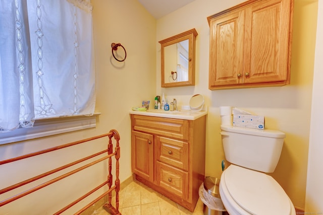 bathroom featuring vanity, toilet, and tile patterned floors