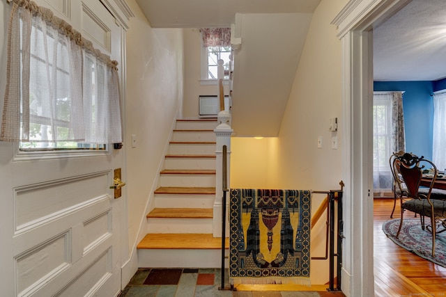 stairway with wood-type flooring