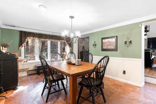 dining room with a chandelier and ornamental molding