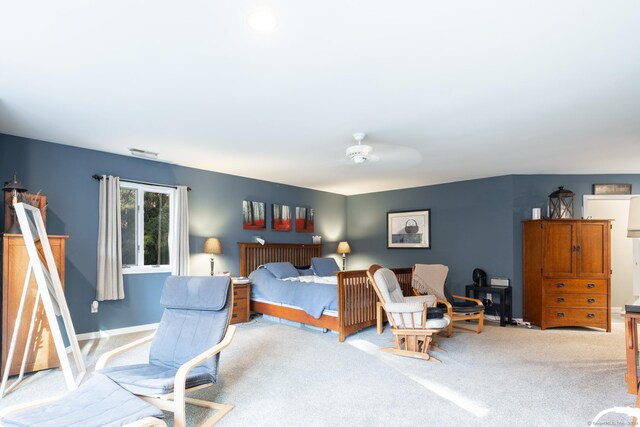 bedroom with ceiling fan and light colored carpet