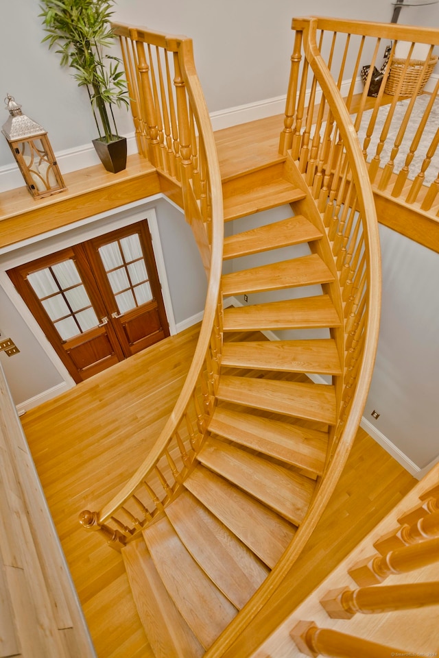 staircase with wood-type flooring