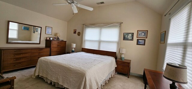 bedroom with light carpet, vaulted ceiling, and ceiling fan