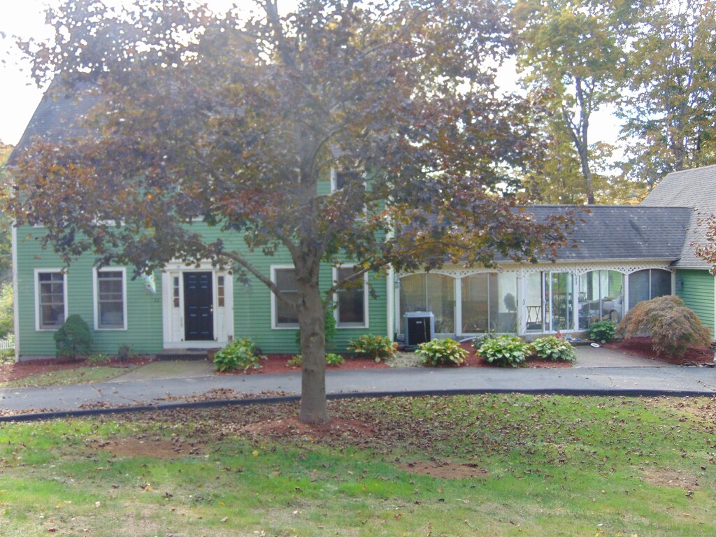 22 Ives Ln, Plymouth, CT 06782 - obstructed view of property with a front yard and central air condition unit