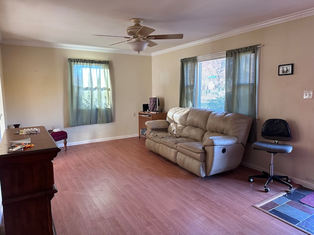 living room featuring crown molding, light hardwood / wood-style flooring, a wealth of natural light, and ceiling fan