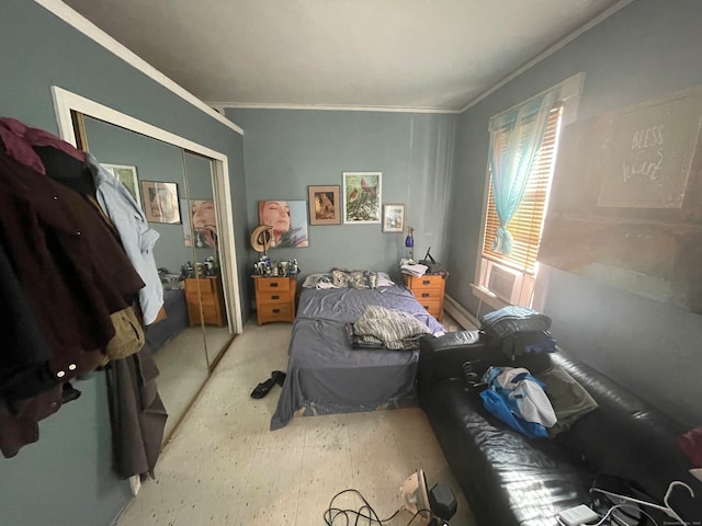 bedroom featuring ornamental molding and a closet