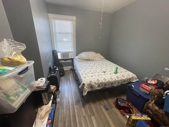 bedroom with dark wood-type flooring