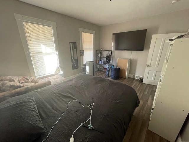 bedroom featuring dark wood-type flooring