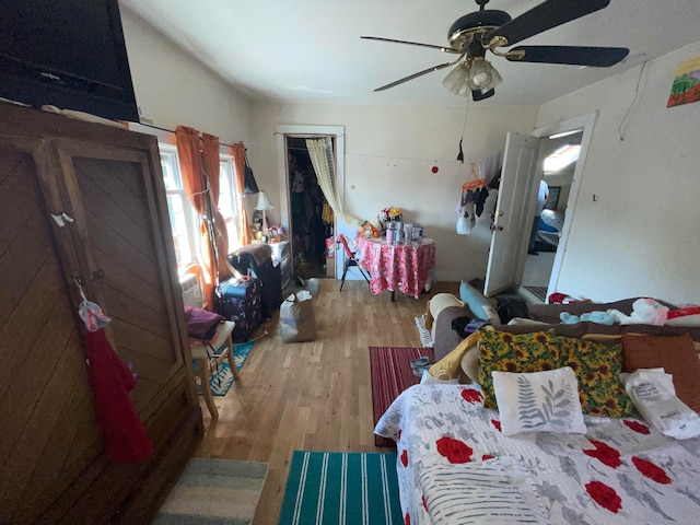 bedroom featuring ceiling fan and light hardwood / wood-style flooring