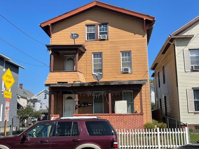 front of property with cooling unit and covered porch