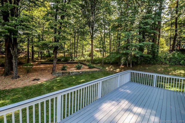 wooden terrace with a yard