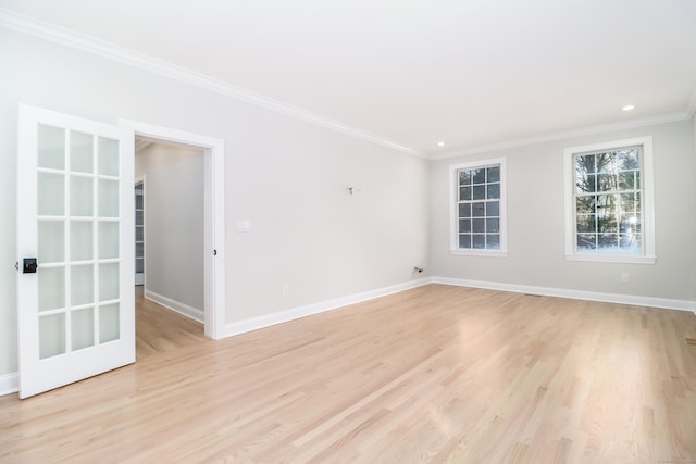 unfurnished room with light hardwood / wood-style flooring and ornamental molding