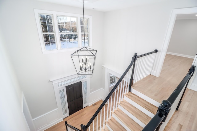 entrance foyer featuring light hardwood / wood-style floors and an inviting chandelier