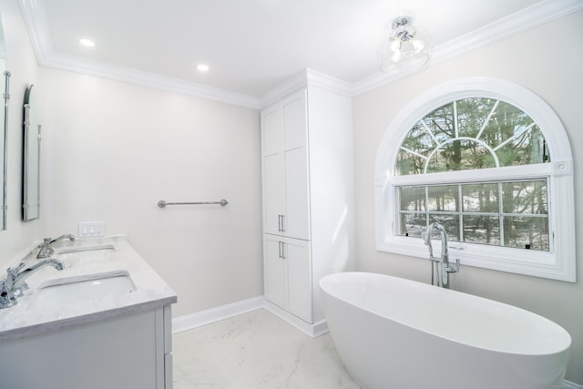 bathroom with a bathing tub, crown molding, and vanity