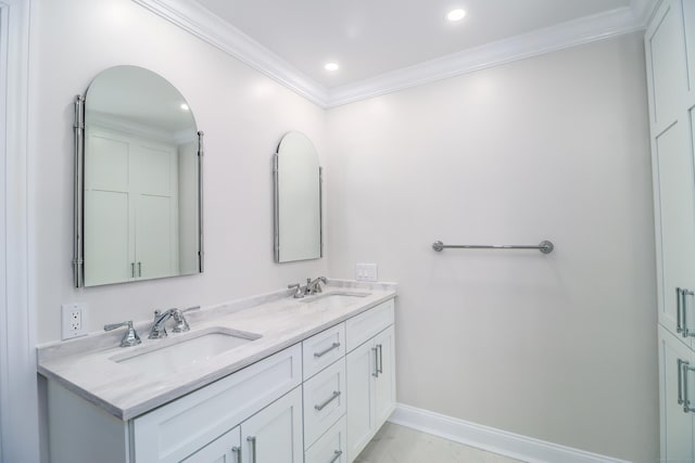 bathroom with vanity and ornamental molding