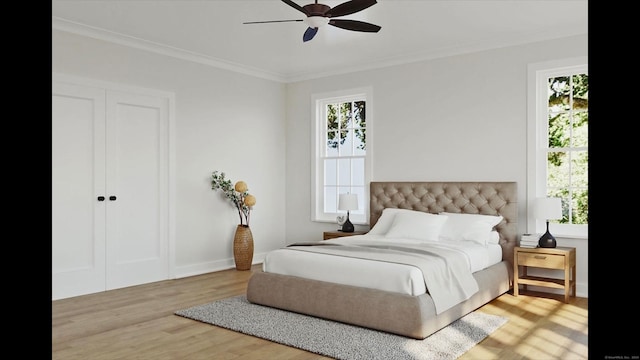 bedroom featuring wood-type flooring, crown molding, multiple windows, and ceiling fan