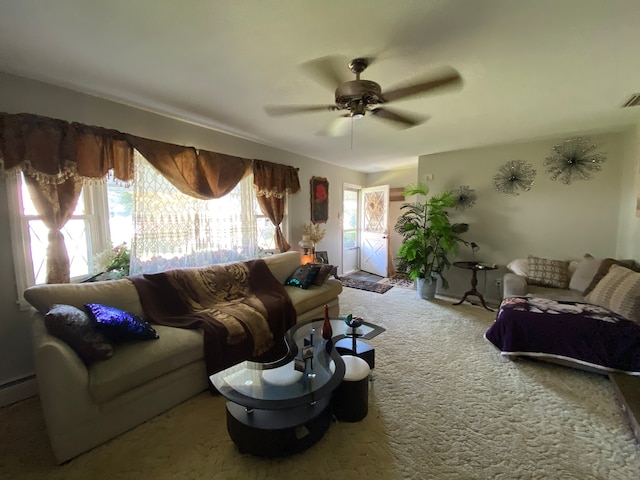 living room with ceiling fan and carpet floors