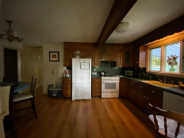 kitchen featuring tasteful backsplash, white appliances, beamed ceiling, hardwood / wood-style floors, and sink