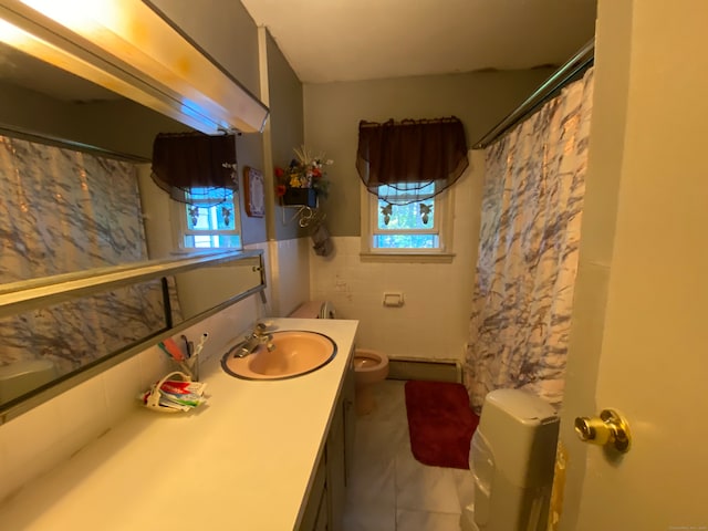 bathroom featuring tile walls, vanity, and toilet