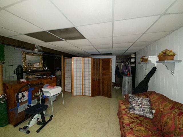 basement featuring a drop ceiling