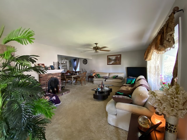 living room with ceiling fan, a fireplace, and carpet