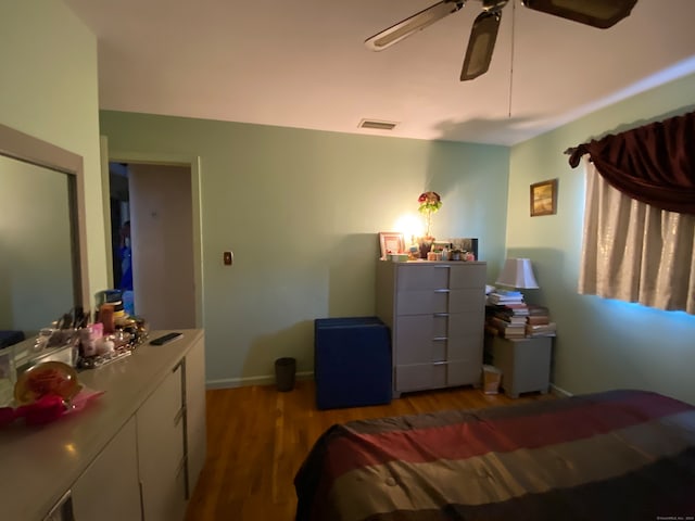 bedroom featuring wood-type flooring and ceiling fan