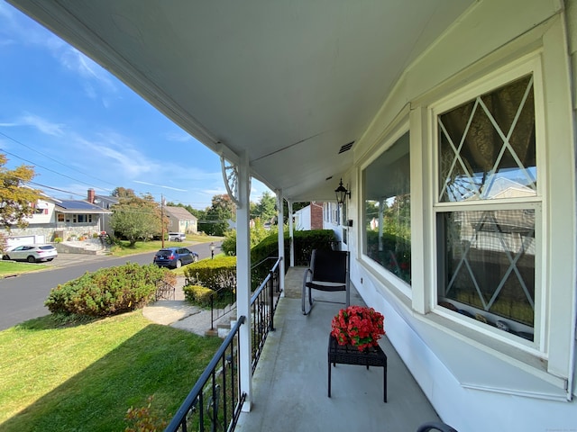 balcony featuring a porch