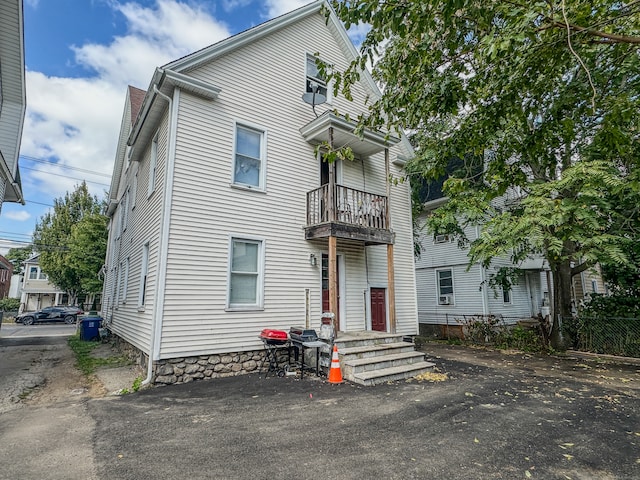 view of front of property with a balcony