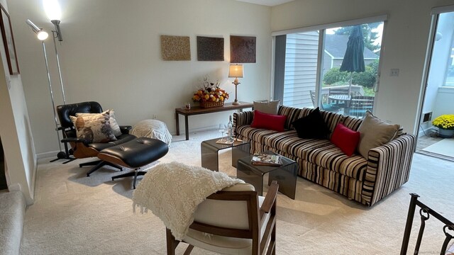 living room featuring light carpet