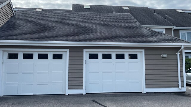 garage featuring wooden walls