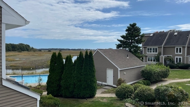 view of side of home with a water view