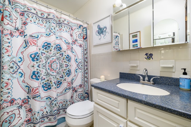 bathroom with tile walls, decorative backsplash, a shower with curtain, vanity, and toilet