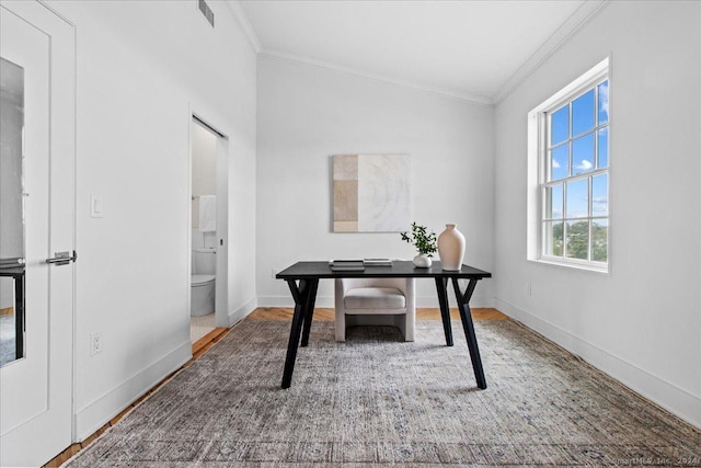 office with wood-type flooring and crown molding