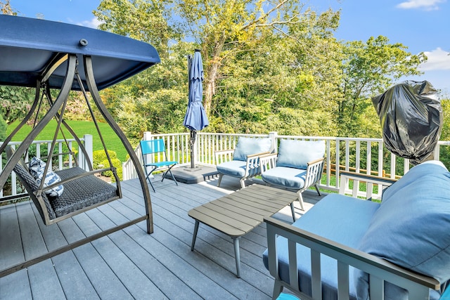 wooden terrace with outdoor lounge area