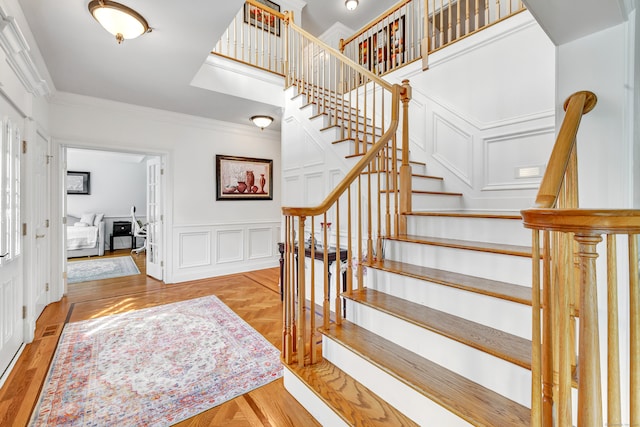 interior space featuring crown molding and light hardwood / wood-style floors